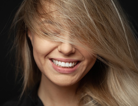 Headshot of smiling woman with perfect teeth